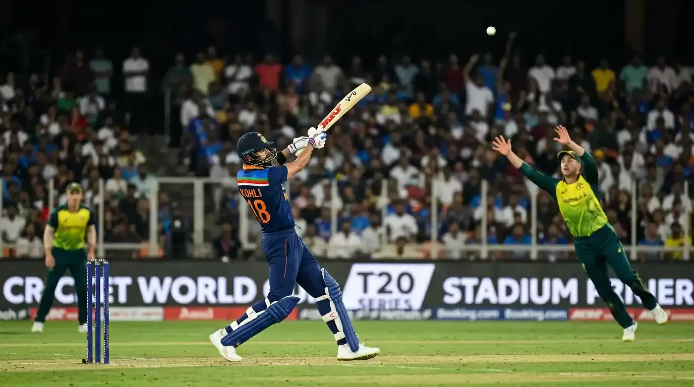 T20 batter following through after hitting a six over midwicket as the white ball clears the boundary rope